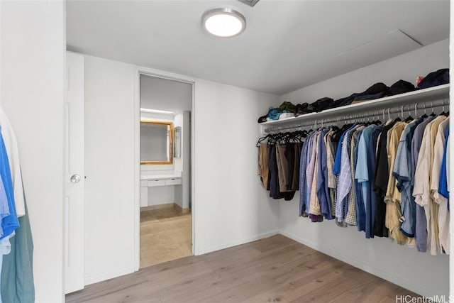 spacious closet with wood finished floors