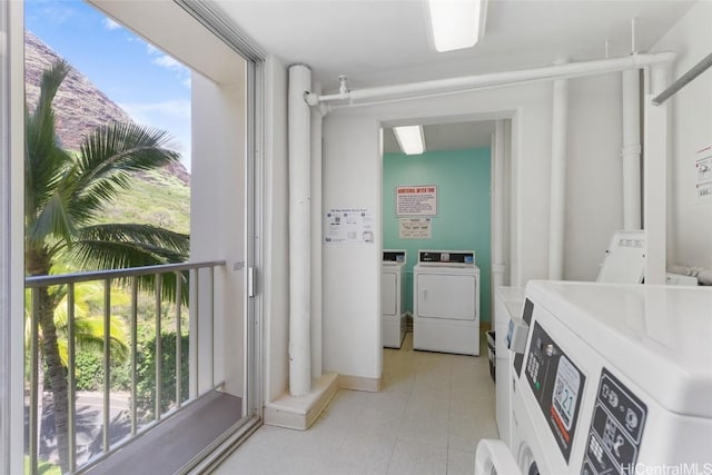 common laundry area with independent washer and dryer