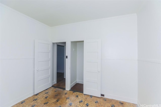 unfurnished bedroom featuring ornamental molding and baseboards