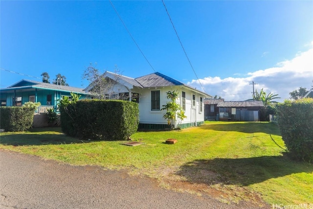 view of home's exterior featuring a lawn