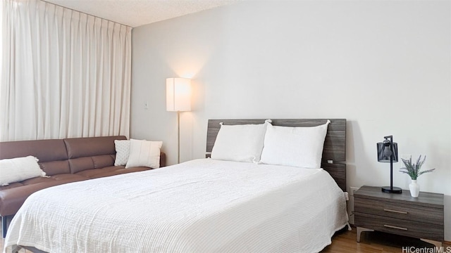 bedroom featuring wood finished floors