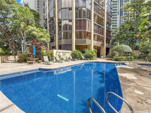 community pool featuring a patio area