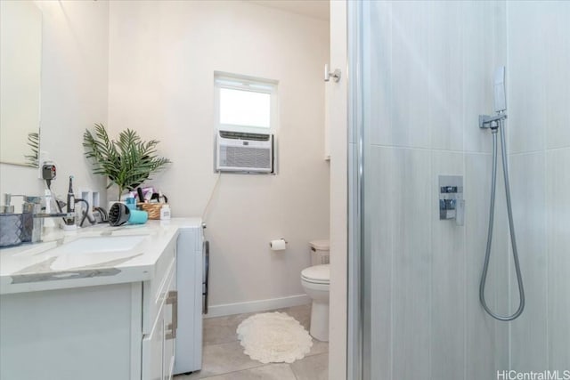 bathroom featuring tile patterned floors, vanity, toilet, and walk in shower