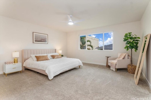 bedroom with light carpet, baseboards, and a ceiling fan