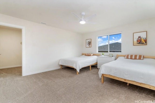 bedroom featuring ceiling fan, carpet floors, visible vents, and baseboards