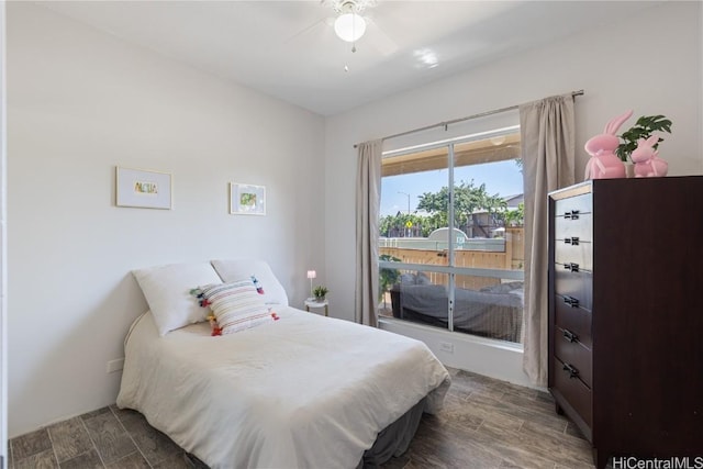 bedroom with a ceiling fan and wood tiled floor