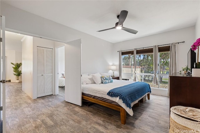 bedroom with a ceiling fan and light wood finished floors