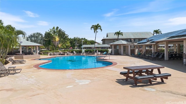 community pool featuring a gazebo and a patio area