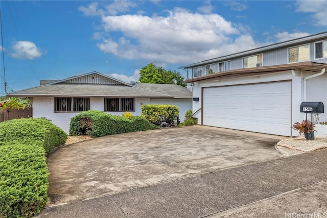 view of front of home featuring concrete driveway