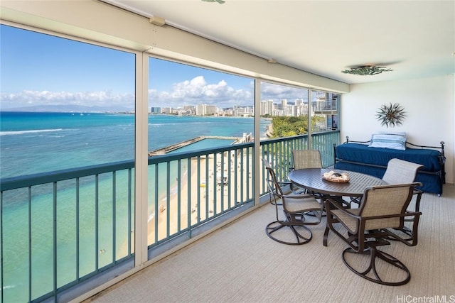 balcony with a water view and a city view