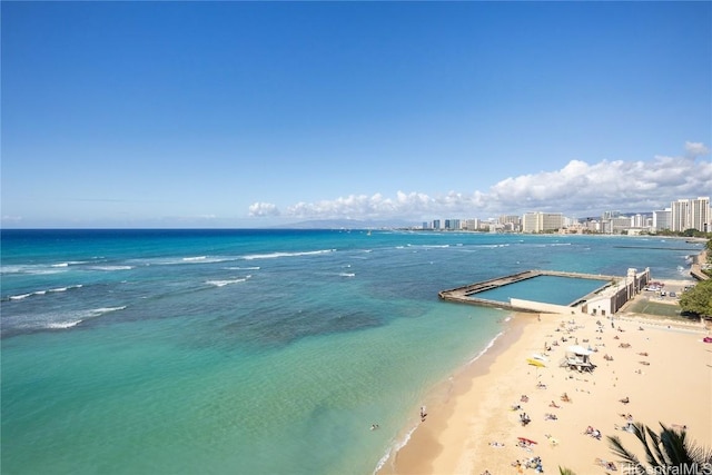 view of water feature with a view of the beach and a city view