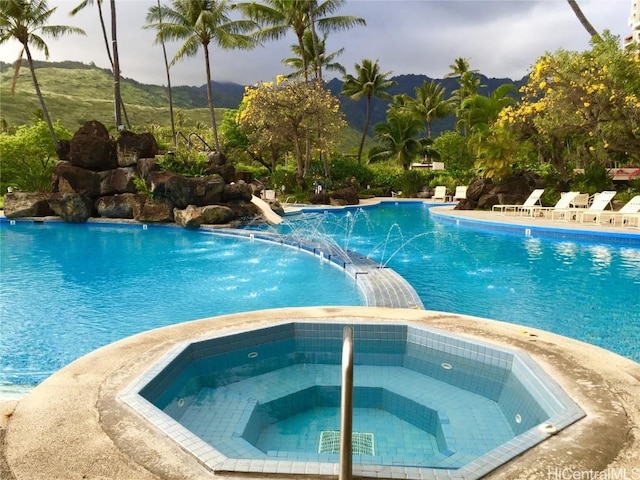 pool featuring a hot tub