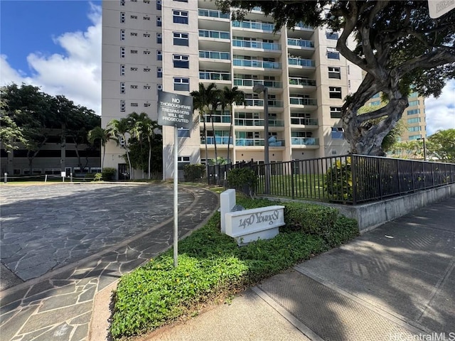 view of property featuring fence