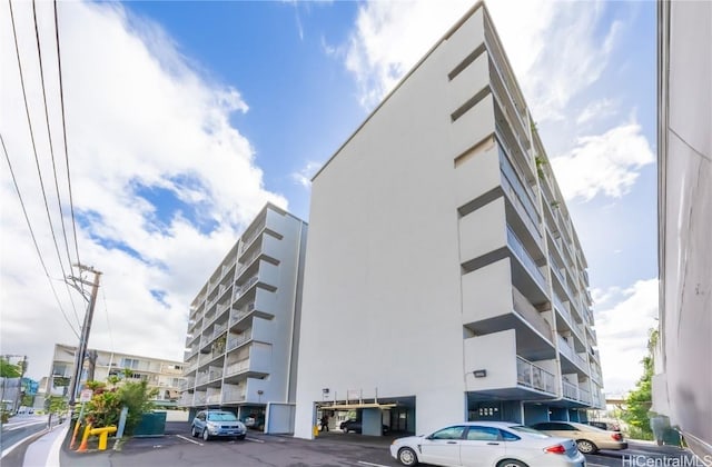 view of property featuring uncovered parking