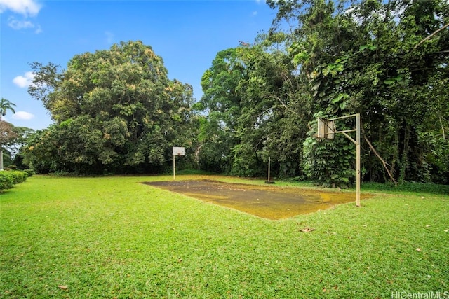 view of yard featuring basketball court