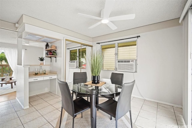 dining area featuring light tile patterned flooring, cooling unit, and a textured ceiling