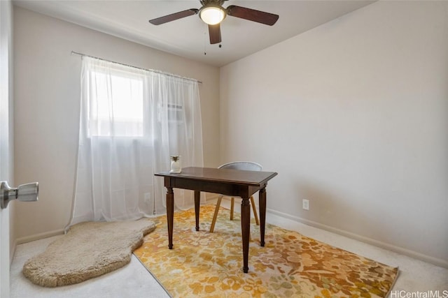 office area featuring ceiling fan and baseboards