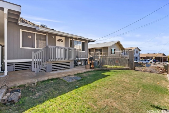 view of front of property with fence and a front lawn