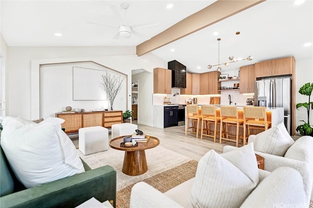 living area with vaulted ceiling with beams, ceiling fan, light wood-type flooring, and recessed lighting