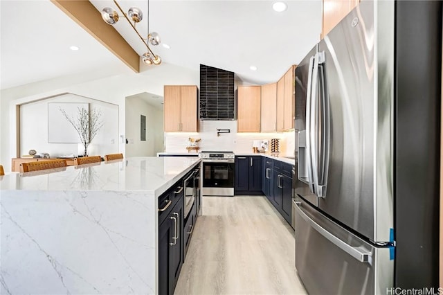 kitchen with backsplash, light wood-style flooring, lofted ceiling with beams, appliances with stainless steel finishes, and light stone countertops