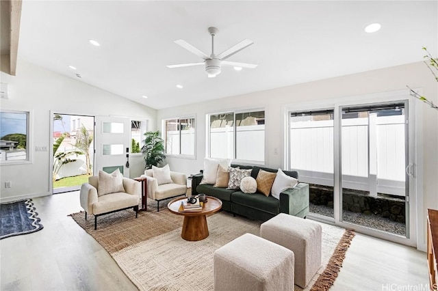 sunroom featuring lofted ceiling and a ceiling fan