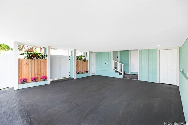 unfurnished living room with concrete floors