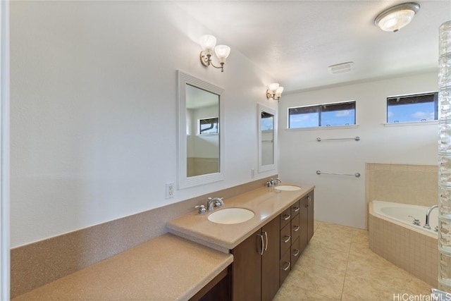 bathroom featuring a bath, double vanity, a sink, and tile patterned floors