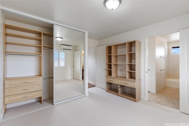 closet featuring a wall mounted air conditioner