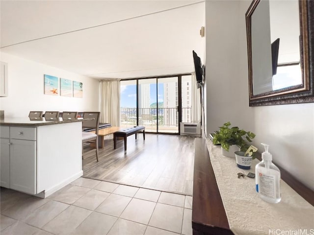 kitchen with light tile patterned floors and expansive windows