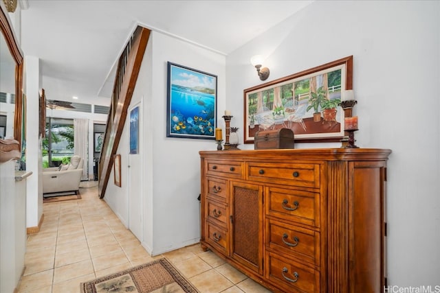 hall with light tile patterned floors