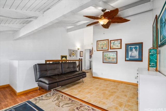 living area featuring vaulted ceiling with beams, ceiling fan, wood ceiling, and baseboards