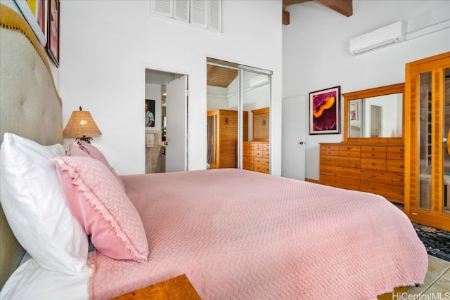 bedroom featuring visible vents, a towering ceiling, beamed ceiling, an AC wall unit, and a closet