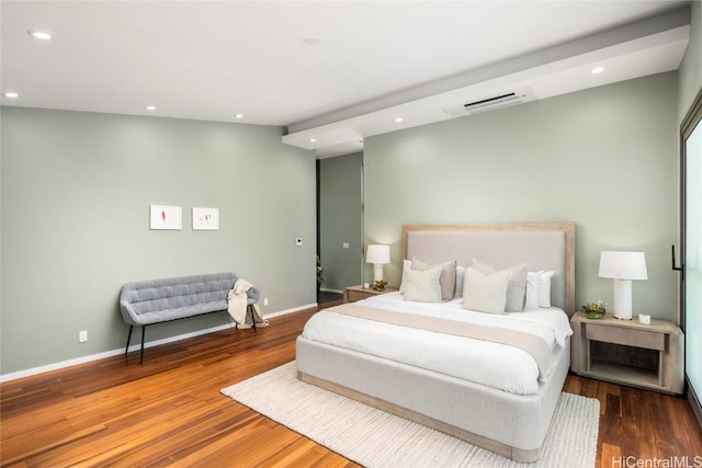 bedroom featuring visible vents, recessed lighting, wood finished floors, and baseboards