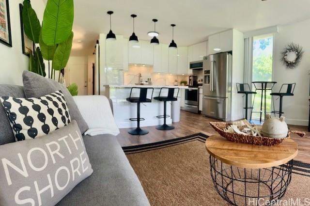 living area featuring dark wood-style flooring