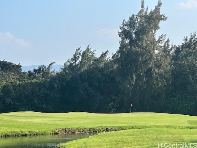 view of property's community featuring view of golf course and a water view