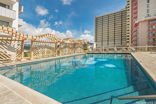 community pool featuring a patio area