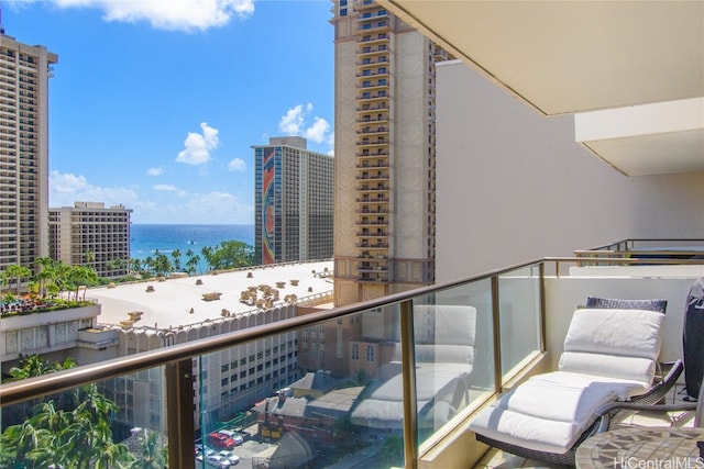 balcony with a water view and a city view