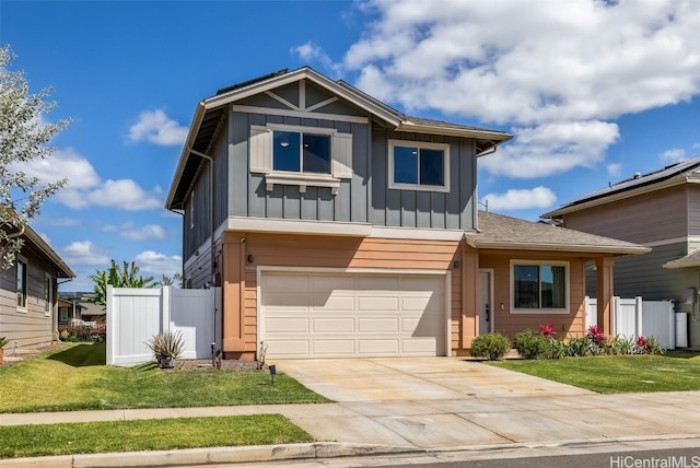 view of front of home with board and batten siding, fence, driveway, and a garage