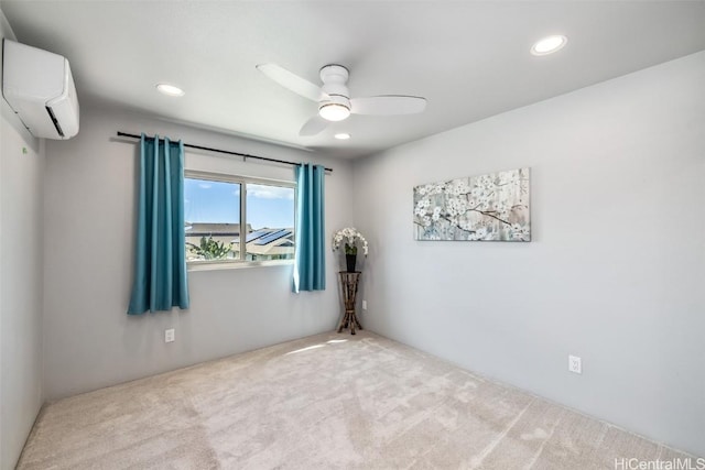 empty room featuring recessed lighting, a ceiling fan, carpet flooring, and a wall mounted AC