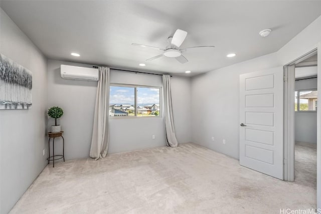 carpeted spare room with a wall mounted AC, recessed lighting, a ceiling fan, and a healthy amount of sunlight