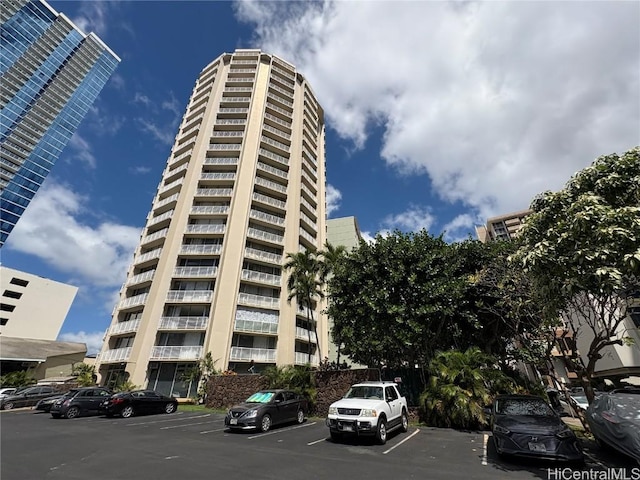 view of property with uncovered parking