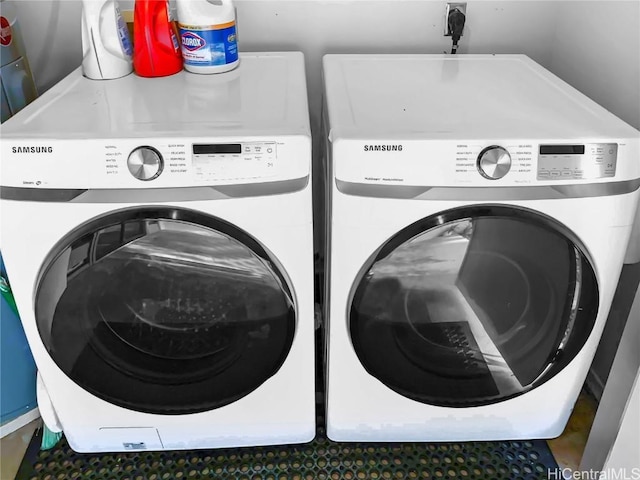 washroom with laundry area and separate washer and dryer