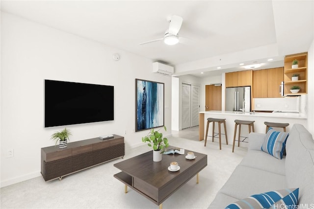 living area with a wall unit AC, recessed lighting, light carpet, ceiling fan, and baseboards