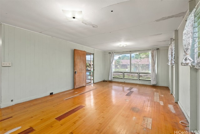 spare room featuring wood-type flooring