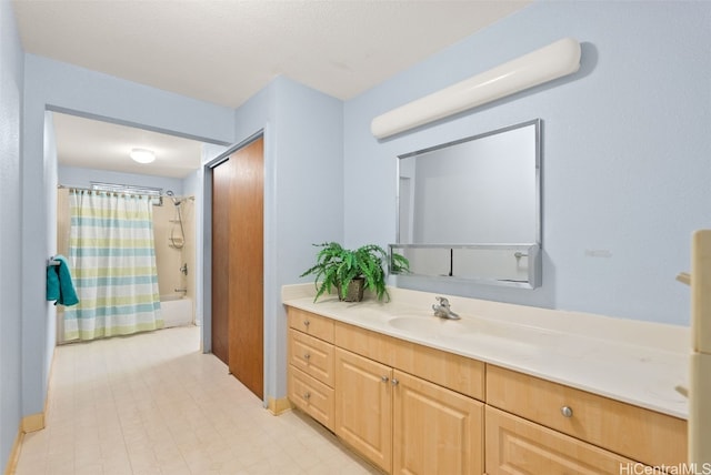 bathroom featuring shower / tub combo with curtain and vanity