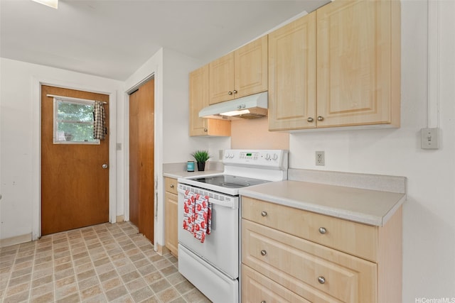 66-826 Haleiwa Rd, Haleiwa, HI 96712 - kitchen with under cabinet range hood, white range with electric cooktop, light countertops, and light brown cabinets