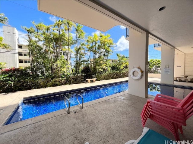 pool with a patio