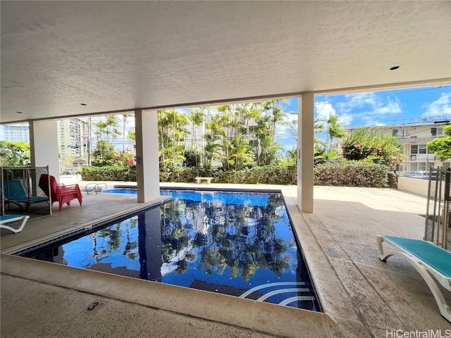 pool with a patio area