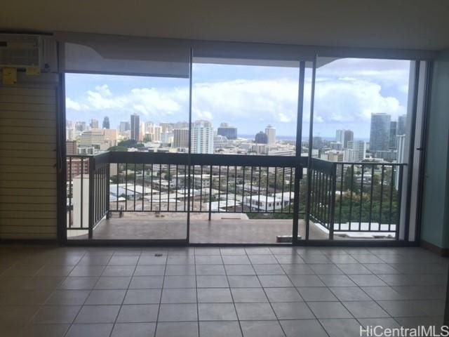 interior space featuring tile patterned flooring and a city view