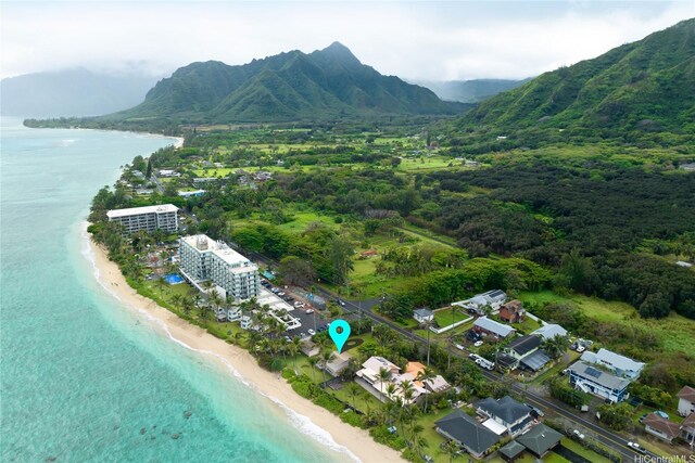 drone / aerial view featuring a beach view and a water and mountain view